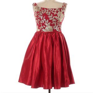 Red and gold. Beautiful quality cocktail dress size 6 but runs small